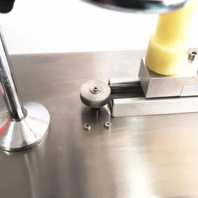 Close-up of ampoule sealer roller and holder assembly Close-up of ampoule sealer roller and holder assembly